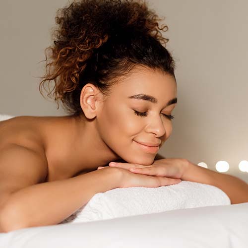 health spa afro woman relaxing in spa with closed TLD92VF