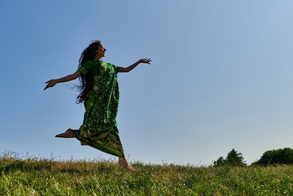 A woman joyfully frolicking in a sunlit field, celebrating the renewed energy and vitality she has gained from Hormone Replacement Therapy (HRT) at Revive and Drip in Washington, PA. This vibrant scene captures the essence of rejuvenation that HRT can provide, restoring the balance of hormones and alleviating symptoms like fatigue, mood swings, and decreased energy. The woman’s carefree expression and lively movement illustrate the transformative impact of HRT, which is part of the comprehensive wellness services offered at Revive and Drip. Alongside treatments like Botox, dermal fillers, IV therapy, and weight loss programs, HRT at Revive and Drip is tailored to help clients reclaim their zest for life and enjoy their days to the fullest.